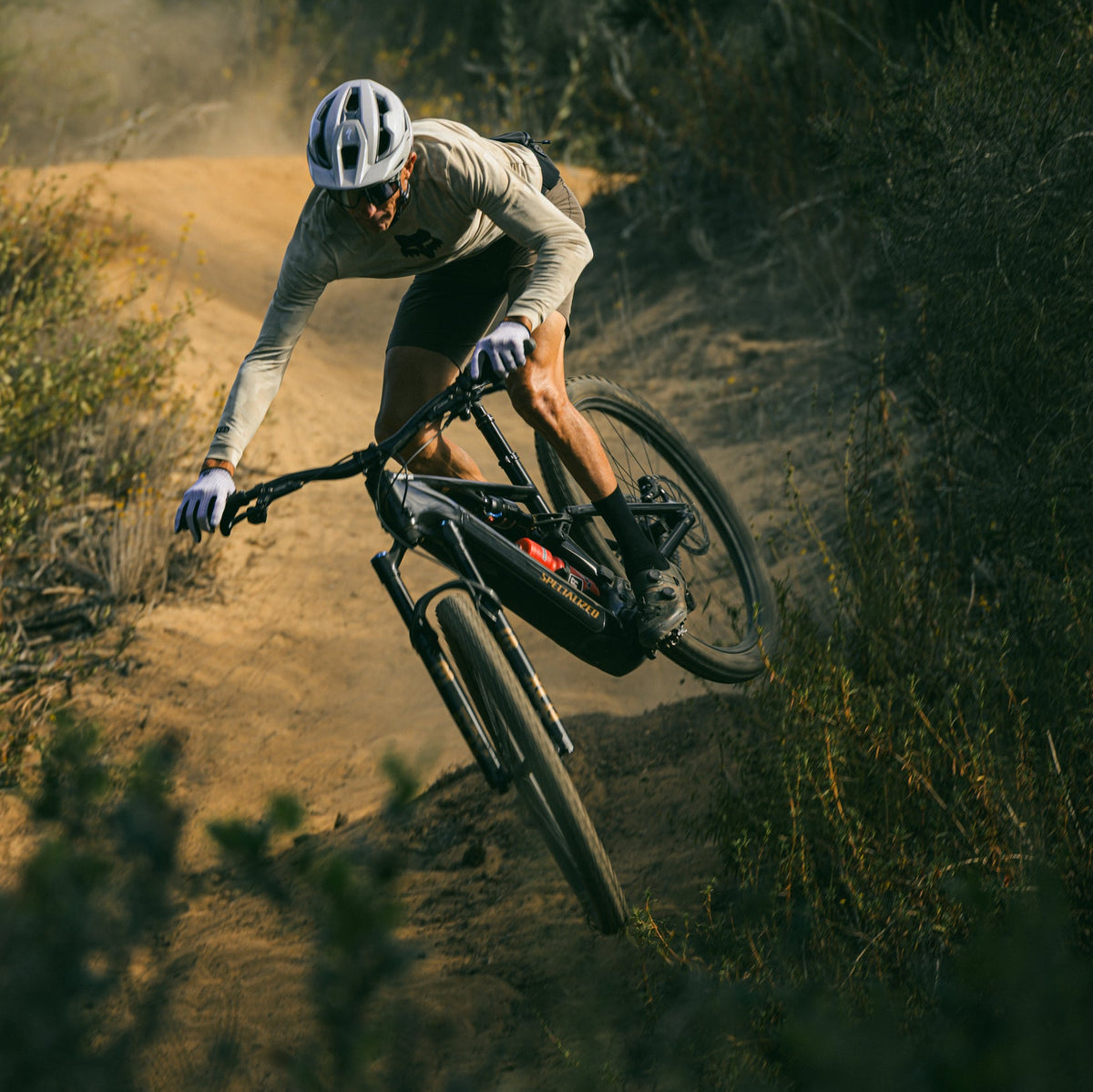 person riding the new specialized levo off a bike jump